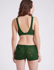 back view of woman wearing green lace bra and short