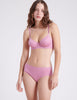 front view of woman wearing pink underwire bra and panty