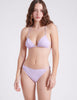front view of woman wearing purple string bikini