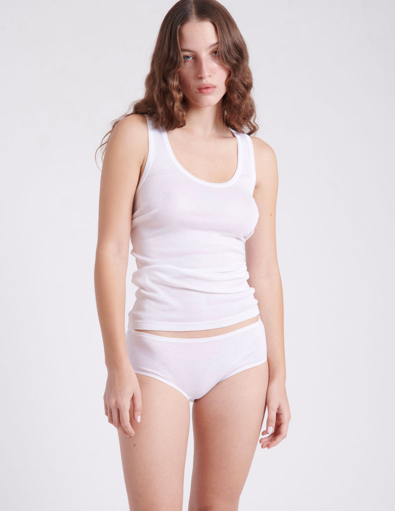 Front view of woman wearing white tank and cotton panty