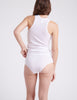 Back view of woman wearing tank top and white panties 