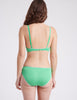 back view of woman in green bra and panty