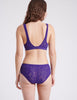 back view of woman in purple bra and panty