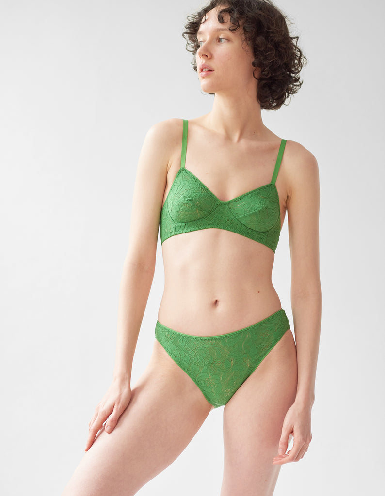 woman wearing green lace wireless bra and matching panty