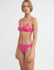 woman wearing pink lace bralette and matching panty by Araks