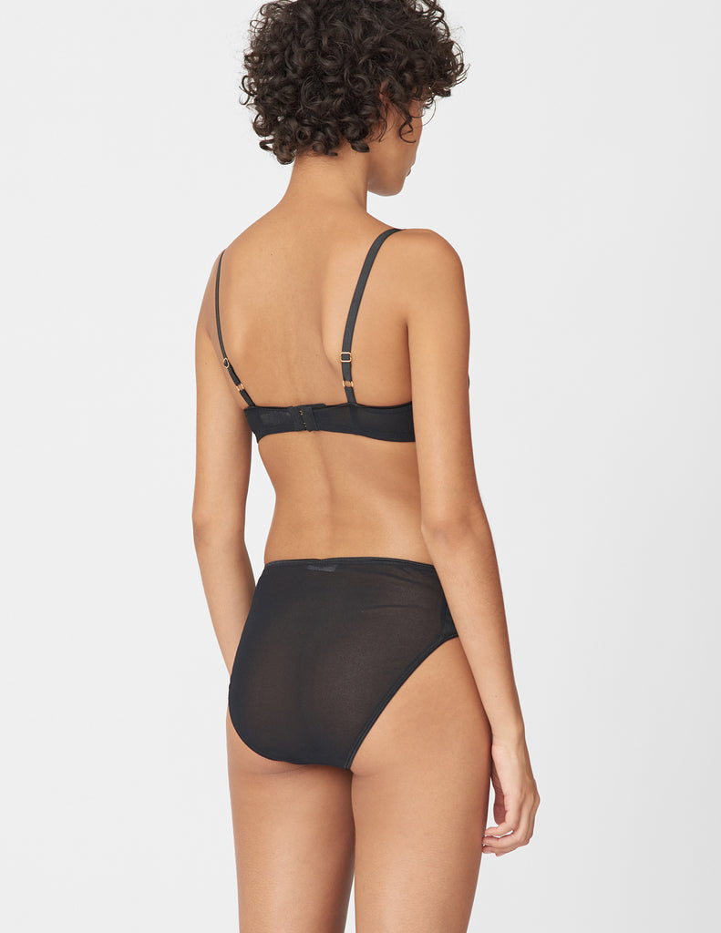 Back view of woman wears black mesh bralette and matching panty