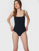 Woman wearing black one piece swimsuit with back cut out