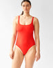 woman wearing a red one piece swimsuit