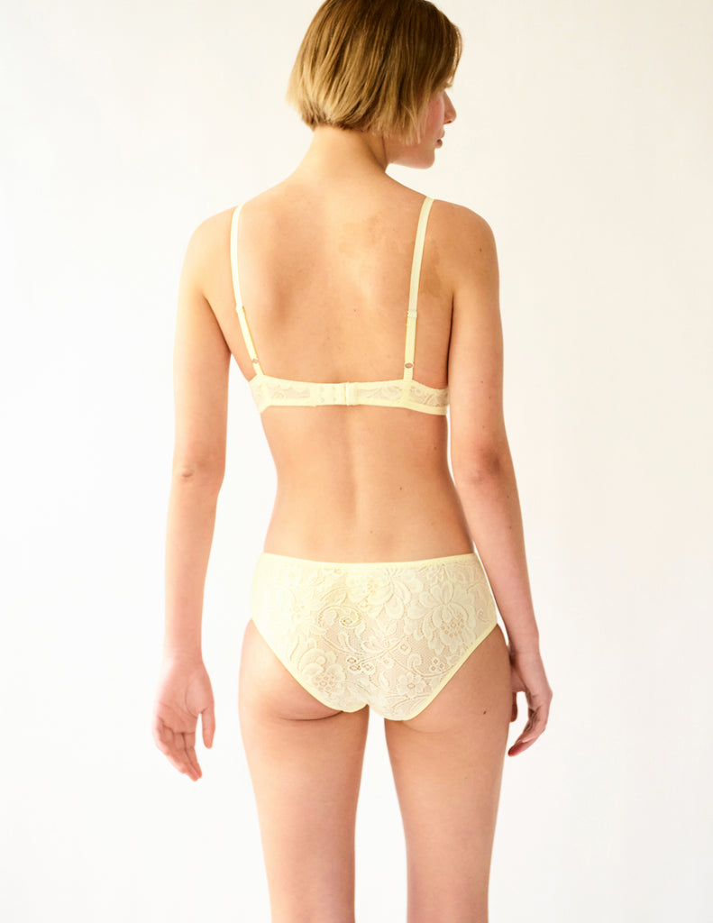 back view of yellow lace bra and panty