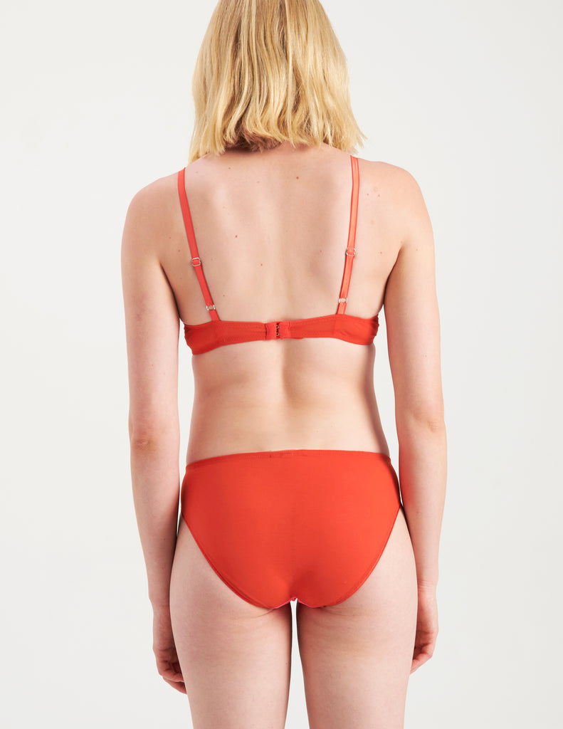 back of woman wearing pink and red cotton and silk bralette with matching panty by Araks