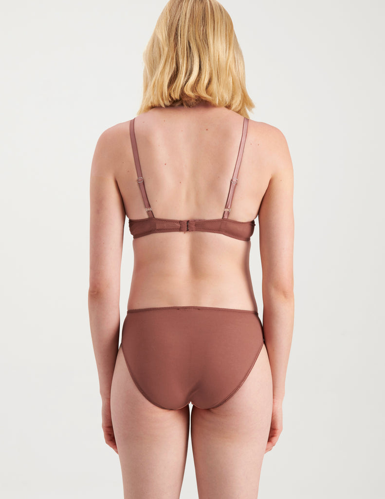 back of woman wearing orange and brown cotton and silk bralette with matching panty by Araks