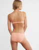 back of woman wearing pink cotton wireless bralette with green silk insert and matching panty by Araks